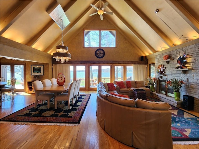 288 Latonka Dr, Jackson Twp Mer, PA 16137 - living area with high vaulted ceiling, beamed ceiling, a chandelier, wood finished floors, and ceiling fan