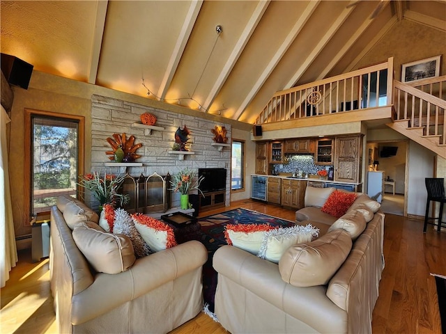 288 Latonka Dr, Jackson Twp Mer, PA 16137 - living room featuring wine cooler, beam ceiling, healthy amount of natural light, high vaulted ceiling, and stairs