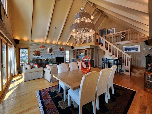 288 Latonka Dr, Jackson Twp Mer, PA 16137 - dining space with high vaulted ceiling, stairway, healthy amount of natural light, beam ceiling, and wood finished floors