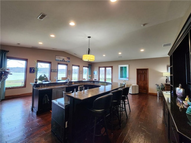 288 Latonka Dr, Jackson Twp Mer, PA 16137 - kitchen featuring a spacious island, dark wood-style flooring, lofted ceiling, stainless steel dishwasher, and recessed lighting