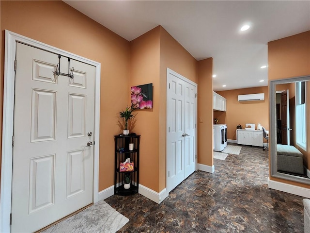288 Latonka Dr, Jackson Twp Mer, PA 16137 - entryway with washing machine and clothes dryer, a wall mounted AC, baseboards, stone finish floors, and recessed lighting