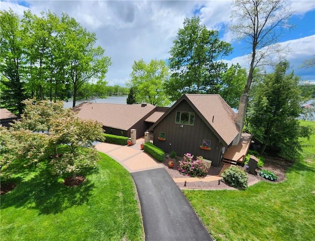 288 Latonka Dr, Jackson Twp Mer, PA 16137 - view of front of property featuring board and batten siding, a front lawn, and a chimney