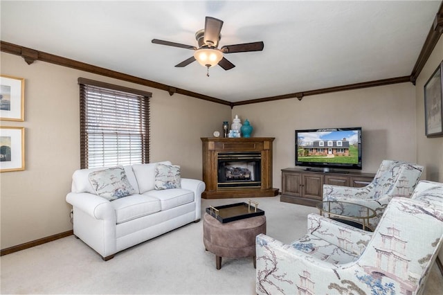 living room featuring crown molding, a ceiling fan, and carpet flooring