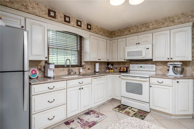 511 Pleasant Valley Rd, Buffalo Twp Wsh, PA 15301 - kitchen featuring white appliances, light tile patterned floors, a sink, tasteful backsplash, and light countertops