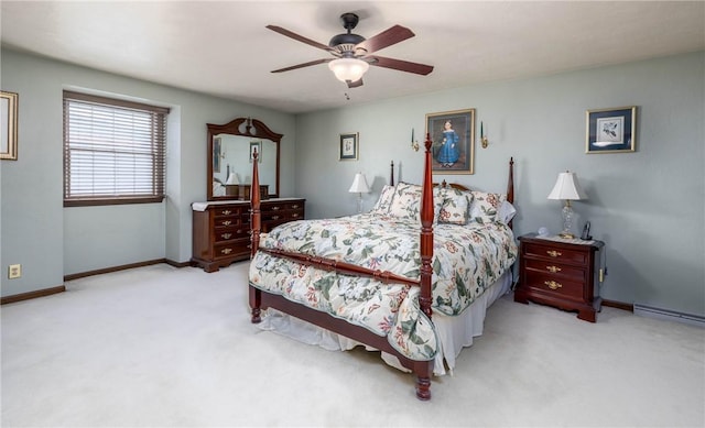 bedroom with a baseboard heating unit, ceiling fan, baseboards, and carpet floors