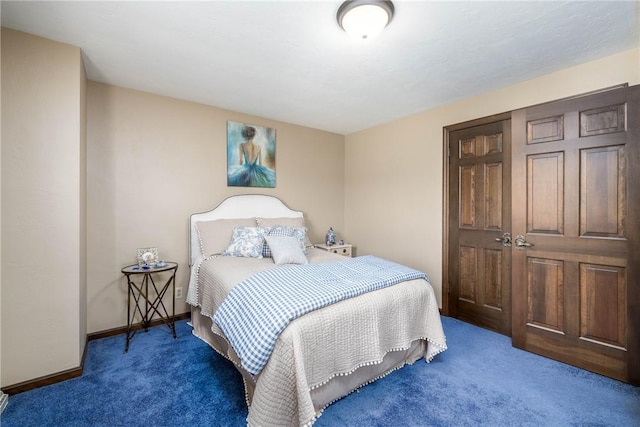 carpeted bedroom with baseboards