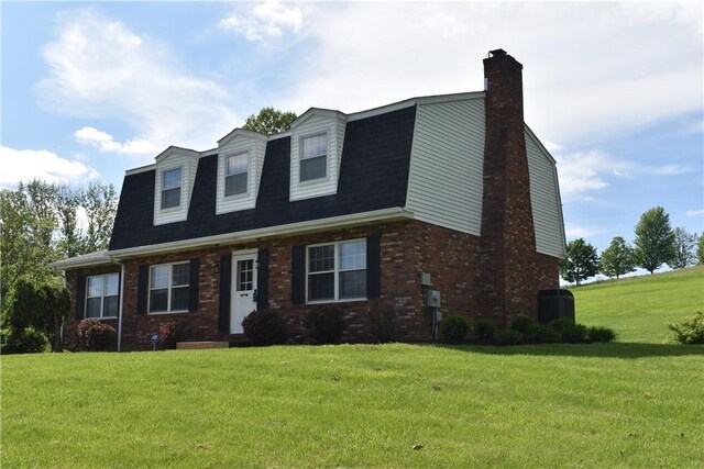 511 Pleasant Valley Rd, Buffalo Twp Wsh, PA 15301 - dutch colonial with a chimney, a front yard, and brick siding