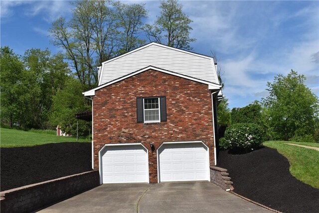 511 Pleasant Valley Rd, Buffalo Twp Wsh, PA 15301 - view of home's exterior with concrete driveway, a garage, and brick siding
