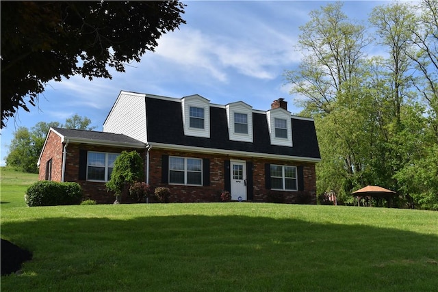 511 Pleasant Valley Rd, Buffalo Twp Wsh, PA 15301 - colonial inspired home featuring a front lawn, brick siding, and a chimney