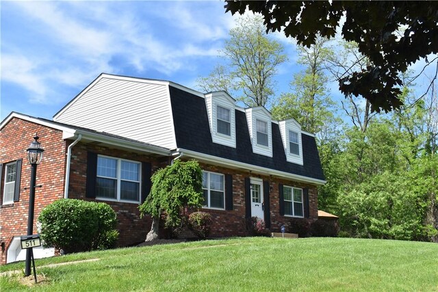 511 Pleasant Valley Rd, Buffalo Twp Wsh, PA 15301 - view of front of property featuring brick siding, a front yard, a gambrel roof, and a shingled roof