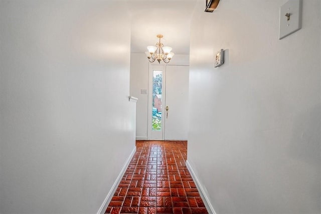 112 Carol Dr, Peters Twp, PA 15317 - corridor with brick floors and a chandelier