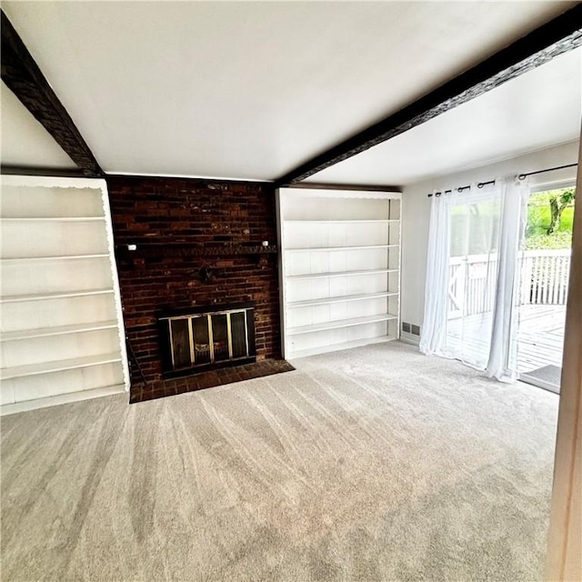 112 Carol Dr, Peters Twp, PA 15317 - unfurnished living room featuring beam ceiling, built in shelves, carpet floors, and a fireplace