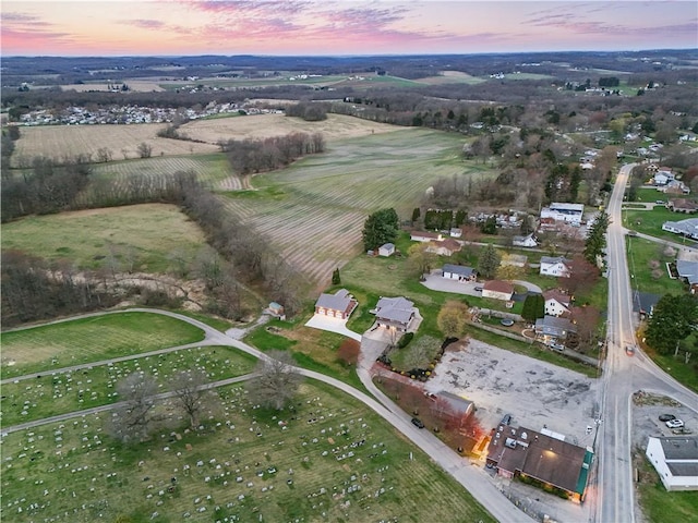 birds eye view of property featuring a rural view