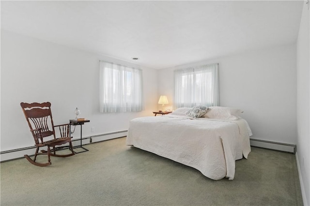bedroom with carpet, multiple windows, and a baseboard heating unit