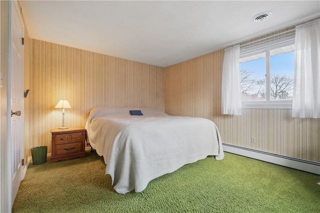 carpeted bedroom featuring a baseboard radiator and visible vents