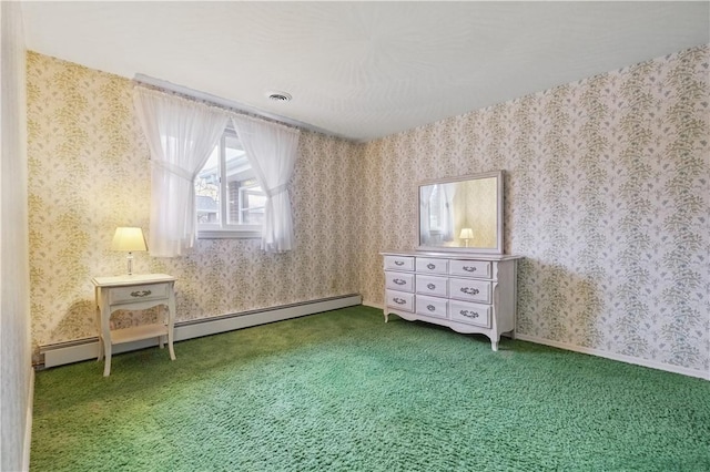 unfurnished bedroom featuring baseboard heating, visible vents, wallpapered walls, and carpet floors