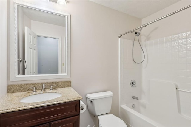 full bath with toilet, vanity, and bathing tub / shower combination