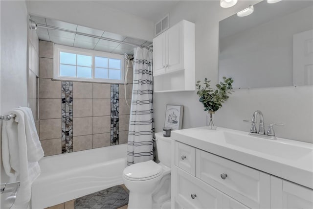 bathroom featuring toilet, shower / bathtub combination with curtain, vanity, and visible vents