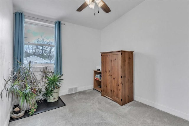 miscellaneous room with carpet, a ceiling fan, vaulted ceiling, visible vents, and baseboards