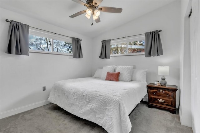 carpeted bedroom with baseboards, ceiling fan, and lofted ceiling