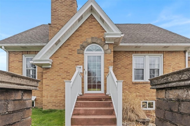 40 Terrace Rd, East Bethlehem, PA 15348 - view of front of home with brick siding, a shingled roof, and a chimney