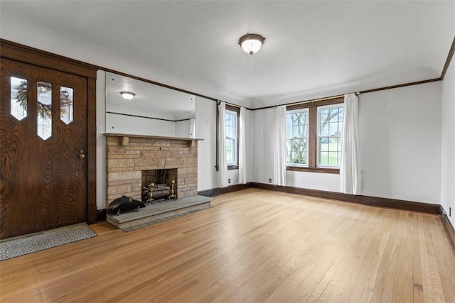 40 Terrace Rd, East Bethlehem, PA 15348 - unfurnished living room with baseboards, hardwood / wood-style floors, and a fireplace