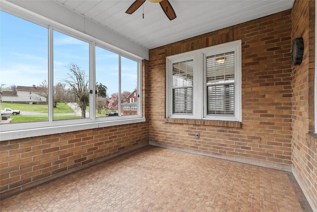 40 Terrace Rd, East Bethlehem, PA 15348 - unfurnished sunroom with tile patterned floors, a ceiling fan, and brick wall