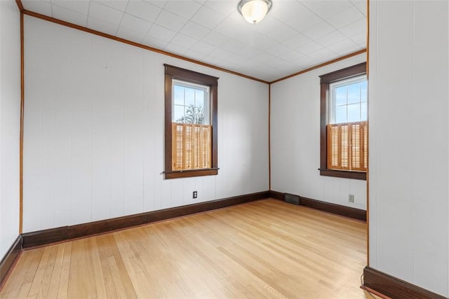 40 Terrace Rd, East Bethlehem, PA 15348 - unfurnished room featuring ornamental molding, baseboards, plenty of natural light, and wood finished floors