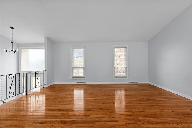 137 Loire Valley Dr, Shaler, PA 15209 - unfurnished room with a chandelier, wood finished floors, baseboards, and visible vents