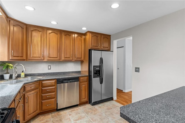 137 Loire Valley Dr, Shaler, PA 15209 - kitchen with stainless steel appliances, brown cabinets, and a sink