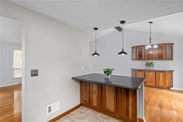 137 Loire Valley Dr, Shaler, PA 15209 - bar with visible vents, hanging light fixtures, baseboards, light wood-style flooring, and lofted ceiling