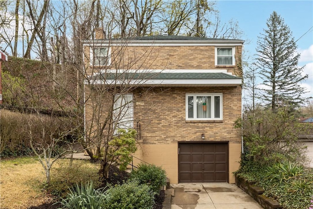 129 Westfield Ave, West View, PA 15229 - view of front of property with brick siding, an attached garage, a shingled roof, and driveway