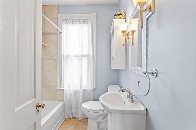 full bath featuring toilet, a healthy amount of sunlight, tile patterned flooring, and shower / washtub combination
