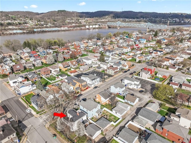 birds eye view of property with a residential view and a water view