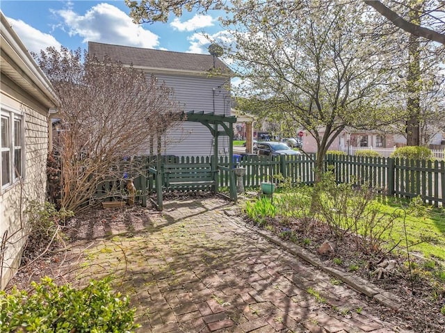 view of yard with a patio and fence