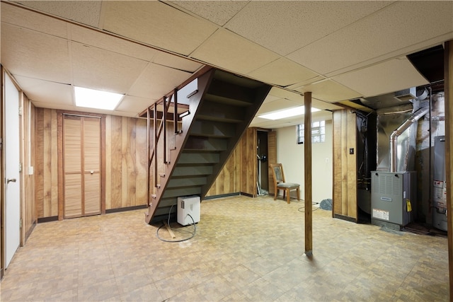 3555 Middleboro Rd, Castle Shannon, PA 15234 - finished below grade area featuring heating unit, wooden walls, stairway, gas water heater, and light floors