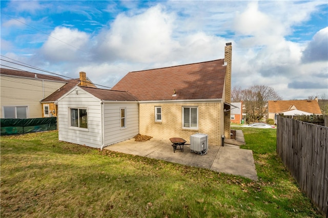 3555 Middleboro Rd, Castle Shannon, PA 15234 - back of property with a lawn, a patio area, fence, brick siding, and a chimney
