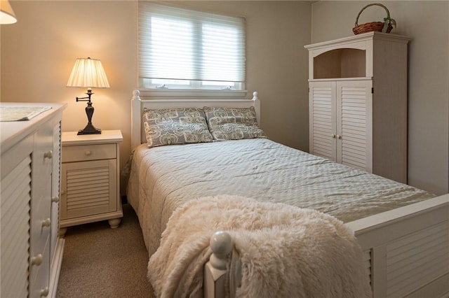 bedroom featuring carpet