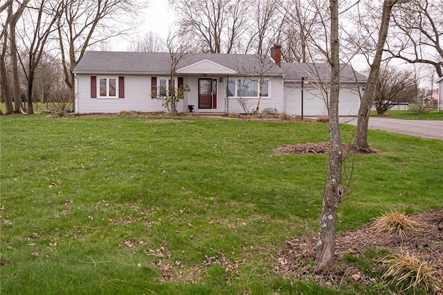 single story home with a garage, a front yard, driveway, and a chimney