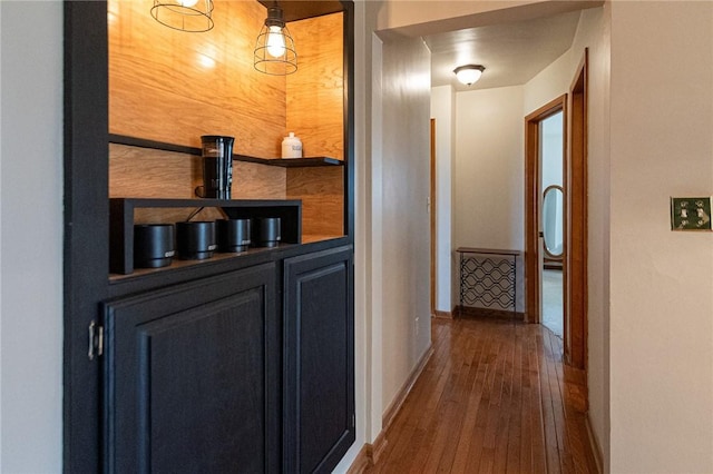 interior space featuring hardwood / wood-style flooring and baseboards