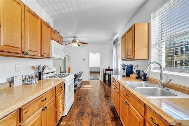 329 Downing St, Polish Hill, PA 15219 - kitchen with dark wood-style flooring, white appliances, light countertops, a ceiling fan, and a sink