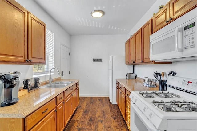 329 Downing St, Polish Hill, PA 15219 - kitchen with white appliances, dark wood-type flooring, light countertops, a sink, and brown cabinets