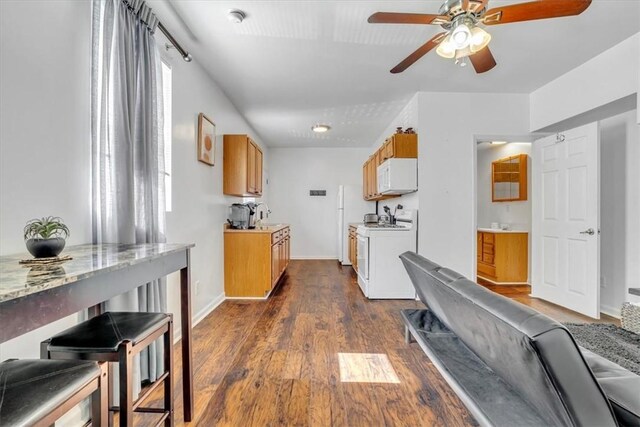 329 Downing St, Polish Hill, PA 15219 - kitchen with a ceiling fan, dark wood-type flooring, light countertops, and white appliances