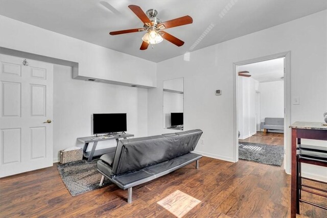 329 Downing St, Polish Hill, PA 15219 - living room featuring baseboards, a ceiling fan, and wood finished floors