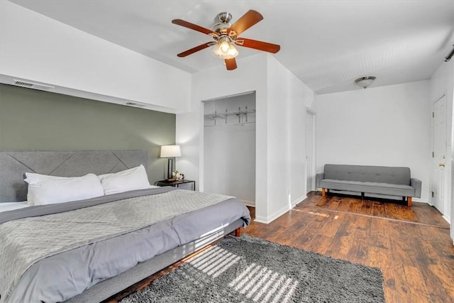 329 Downing St, Polish Hill, PA 15219 - bedroom featuring a closet, baseboards, visible vents, ceiling fan, and wood finished floors