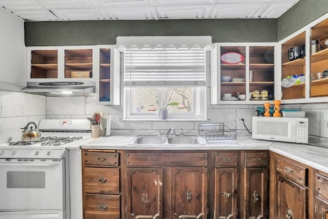 329 Downing St, Polish Hill, PA 15219 - kitchen featuring tasteful backsplash, a sink, light countertops, white appliances, and under cabinet range hood