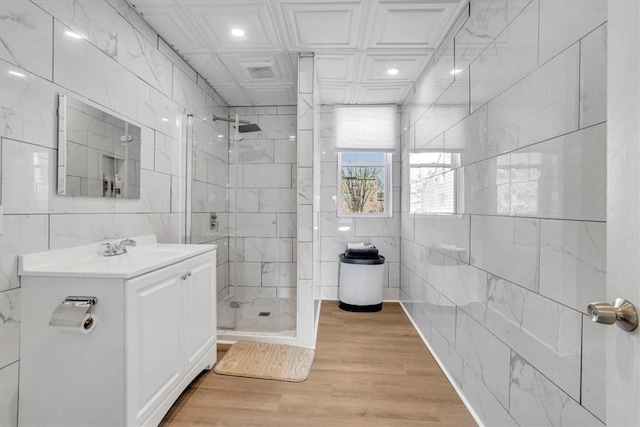 329 Downing St, Polish Hill, PA 15219 - full bath with tile walls, recessed lighting, vanity, wood finished floors, and a stall shower