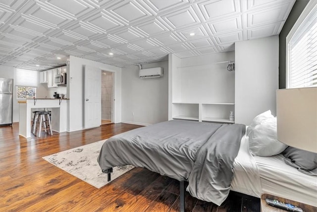 329 Downing St, Polish Hill, PA 15219 - bedroom featuring an ornate ceiling, an AC wall unit, freestanding refrigerator, and dark wood-style flooring