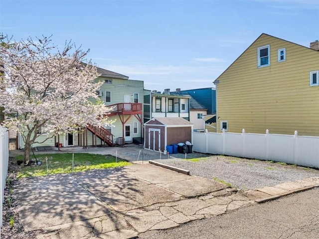329 Downing St, Polish Hill, PA 15219 - exterior space featuring an outbuilding, fence, a storage unit, and stairs