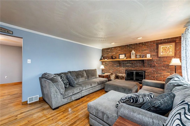 225 Circle Dr, White Oak, PA 15131 - living area with light wood-style floors, baseboards, ornamental molding, and visible vents
